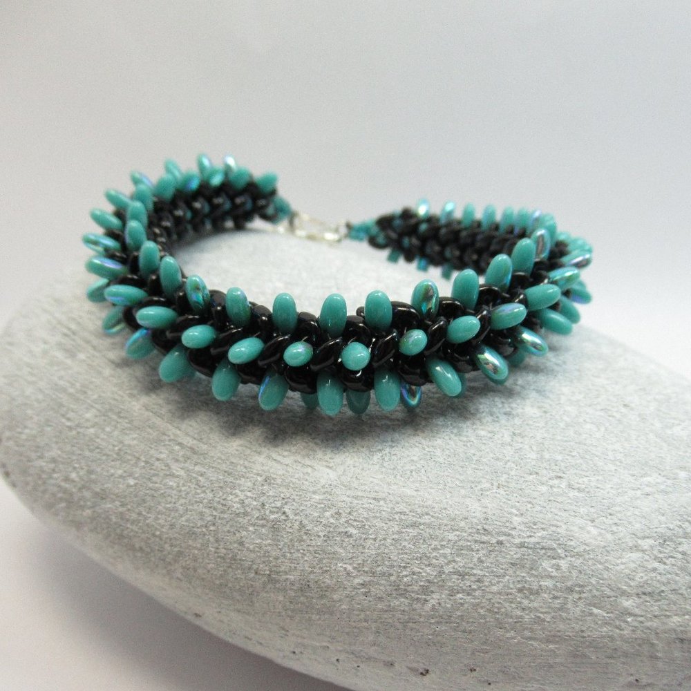 Handwoven teal and black bracelet